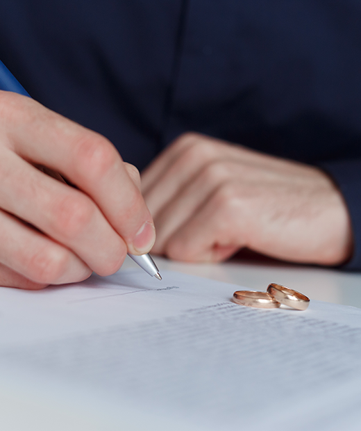 alone-husband-signing-divorce-agreement