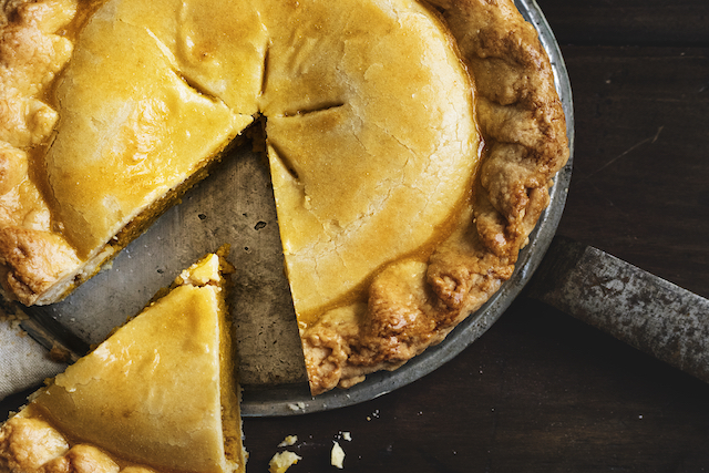 Close up of a pumpkin pie pumpkin pie being sliced to represent 80 20 split divorce uk