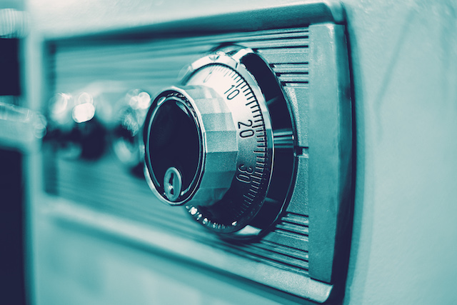 closeup rotation dial-number key lock on safe-box, representing revelations via form e questionnaires