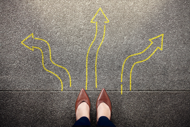 a woman's feet, shot from above, with three arrows pointing in different directions, representing the three main choices in divorce pension sharing