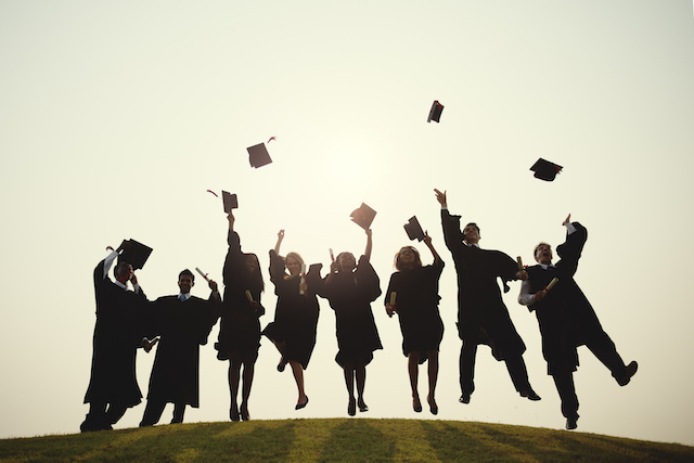 Young Students Graduation Ceremony Concept happy graduates throw their mortars into the air to represent the core of the subject child maintenance university